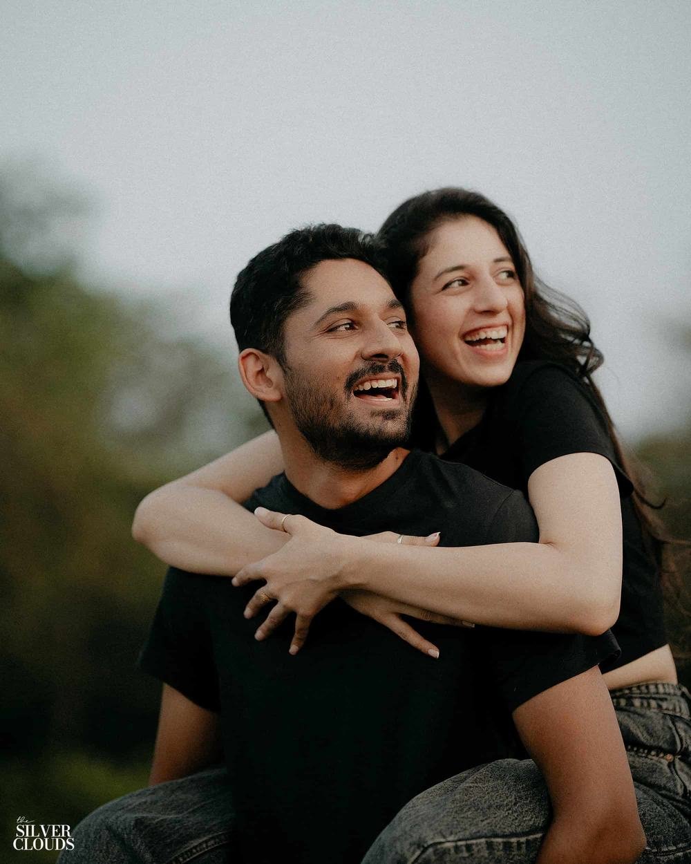Caught laughing, one carried on the other's back
