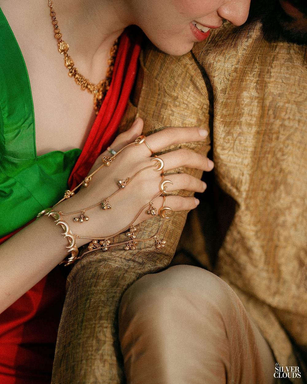 Hands, bangles and a fistful of silk