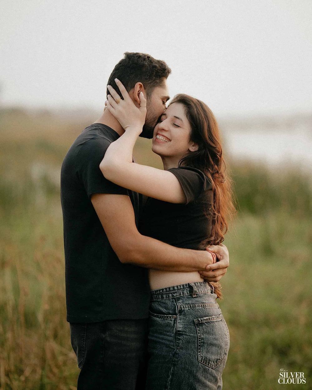 Arms around from behind, the light going soft